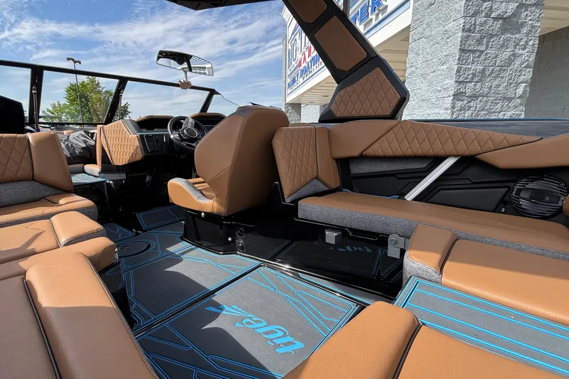 Slide: The Image of Interior of 2026 Tigé Z3 boat with luxurious brown seating and modern design. - 22