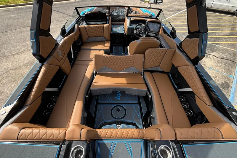 Slide: The Image of 2026 Tigé Z3 boat interior with luxurious brown leather seating and modern dashboard. - 25