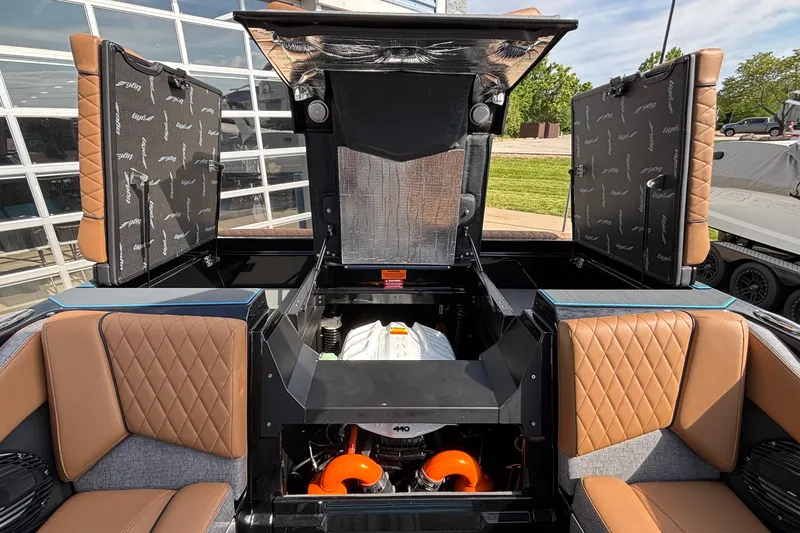 Slide: The Image of 2026 Tigé Z3 boat interior with open engine compartment and luxurious seating. - 28