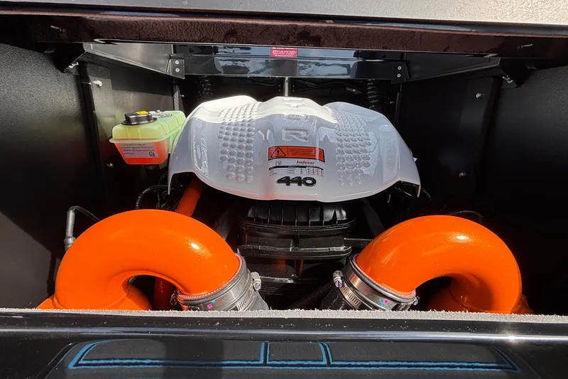 Slide: The Image of 2026 Tigé Z3 engine compartment with Indmar 440 engine and bright orange components. - 29