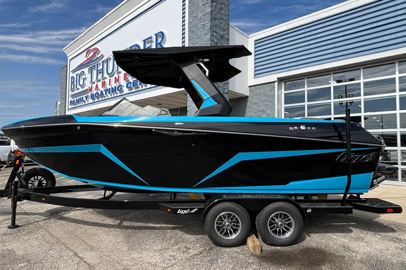 Slide: The Image of 2026 Tigé Z3 boat in black and blue at Big Thunder Marine dealership. - 30
