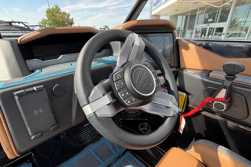 Slide: The Image of 2026 Tigé Z3 boat interior with modern steering wheel and control panel. - 33