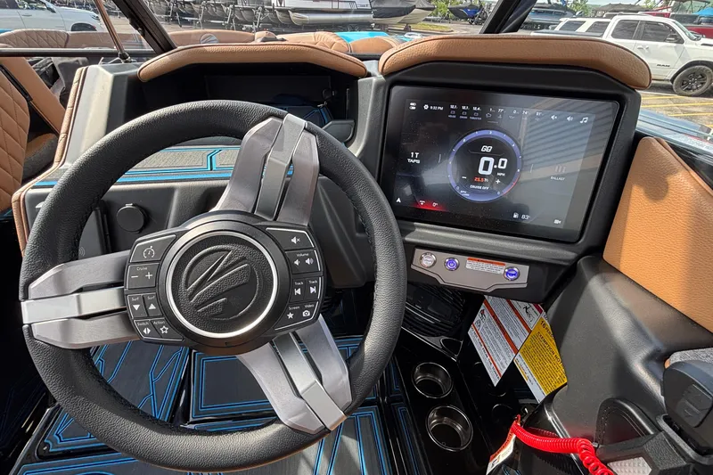 Slide: The Image of 2026 Tigé Z3 boat dashboard with steering wheel and digital display. - 34