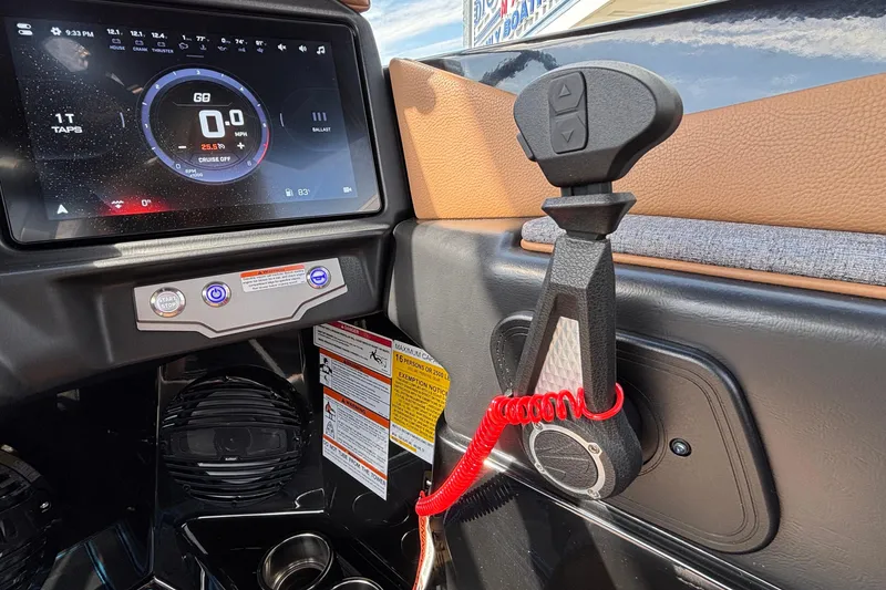 Slide: The Image of 2026 Tigé Z3 boat dashboard with touchscreen display and control lever. - 36