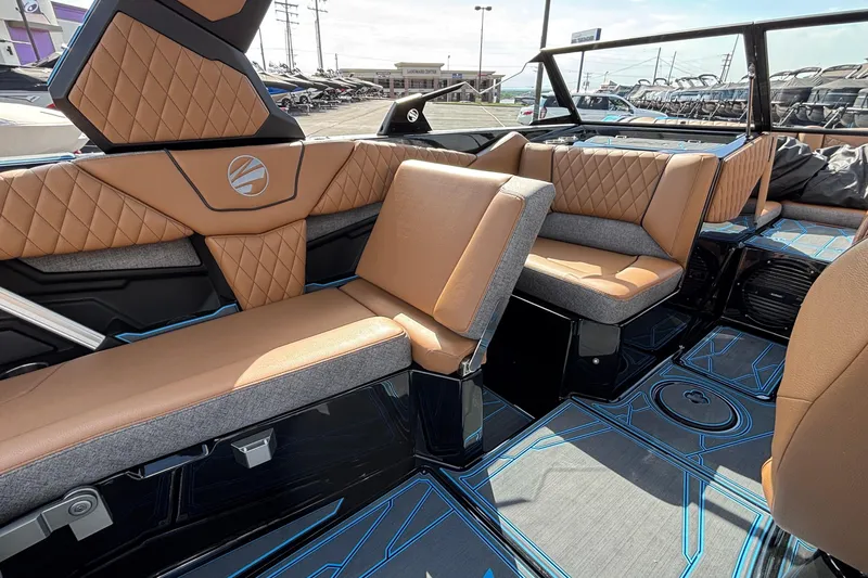 Slide: The Image of Luxurious interior of 2026 Tigé Z3 boat with tan and gray seating, modern design. - 42