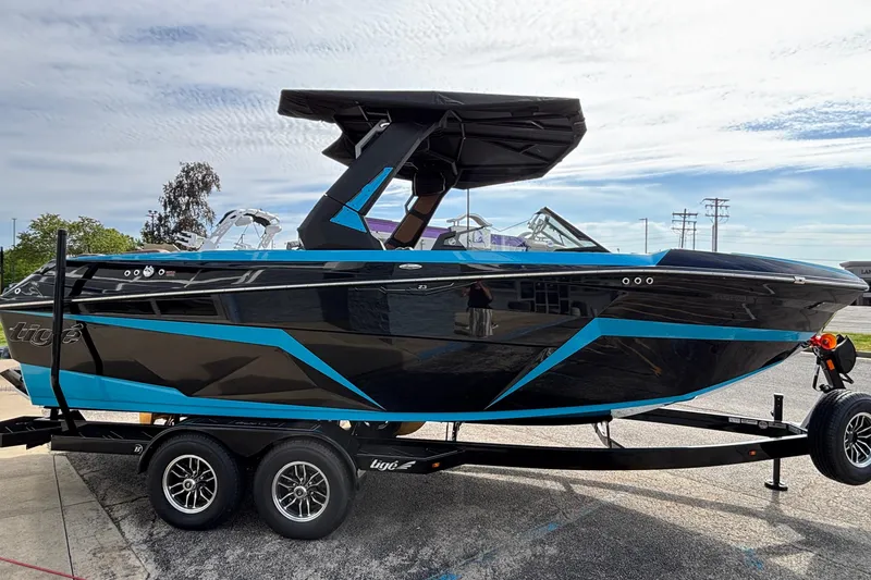 Slide: The Image of 2026 Tigé Z3 boat with sleek black and blue design on a trailer. - 5