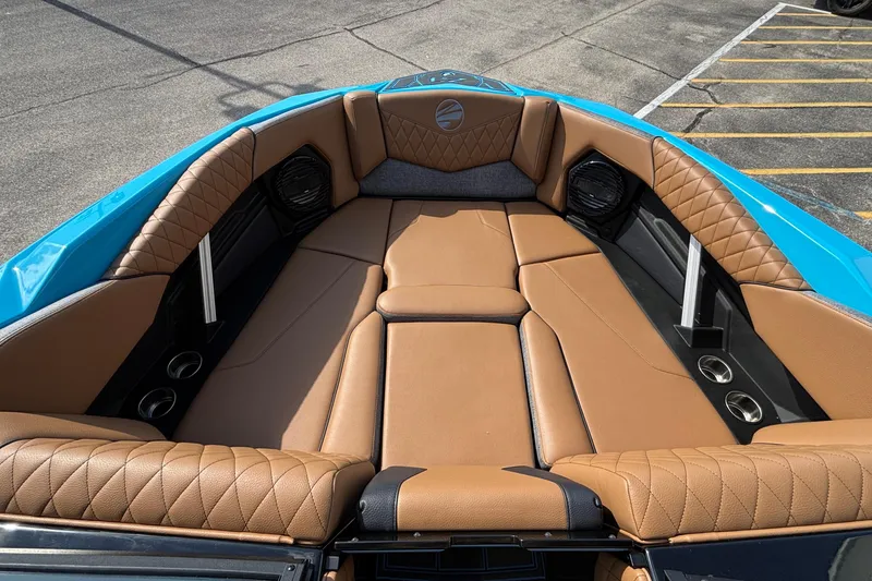 Slide: The Image of Luxurious interior of 2026 Tigé Z3 boat with tan leather seating and blue accents. - 51