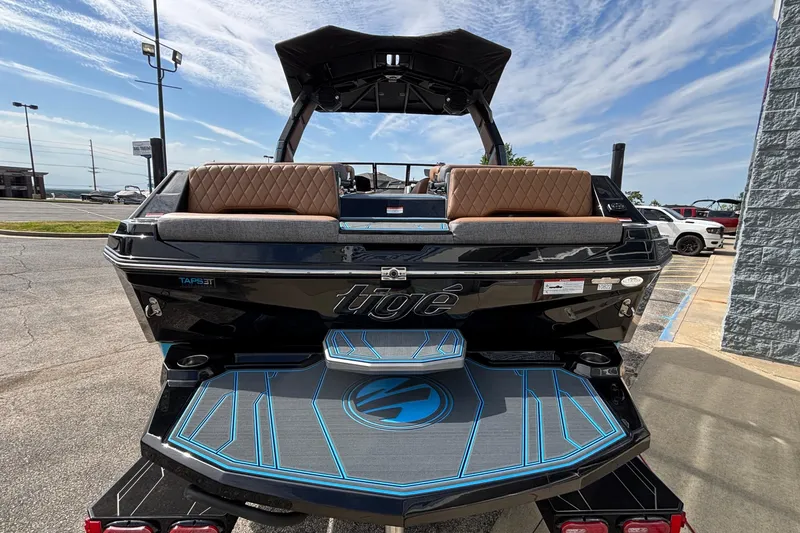 Slide: The Image of 2026 Tigé Z3 boat rear view with sleek design and luxurious seating. - 8