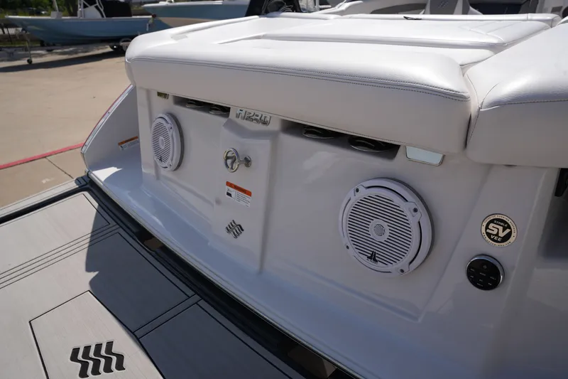 Slide: The Image of Rear view of 2019 Four Winns H230 boat with speakers. - 11
