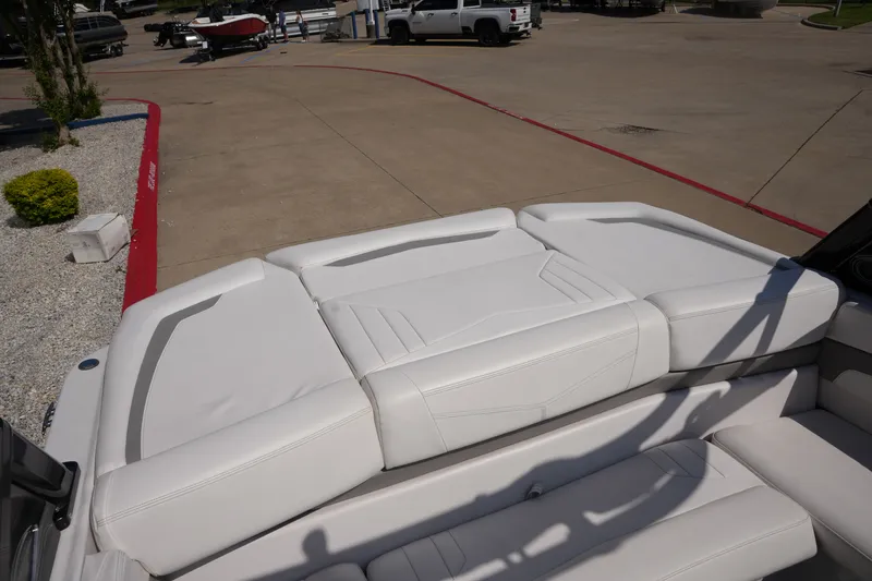 Slide: The Image of 2019 Four Winns H230 boat with white upholstered seating. - 15
