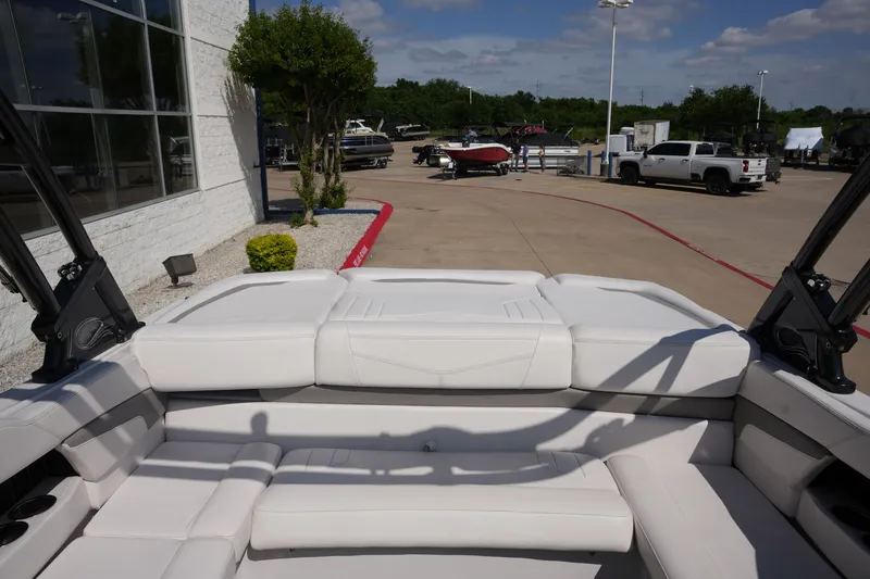 Slide: The Image of Interior of a 2019 Four Winns H230 boat on a parking lot. - 16