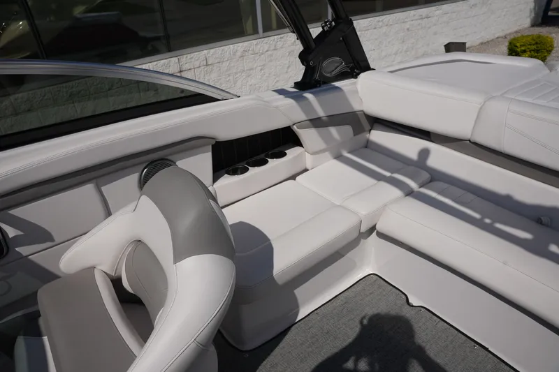 Slide: The Image of Interior of a 2019 Four Winns H230 boat with white seating. - 17