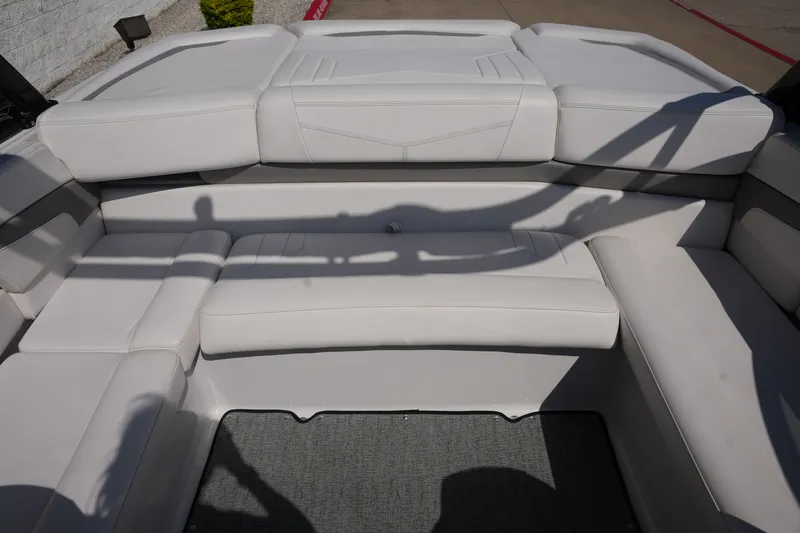 Slide: The Image of Interior of 2019 Four Winns H230 boat with white upholstery. - 18