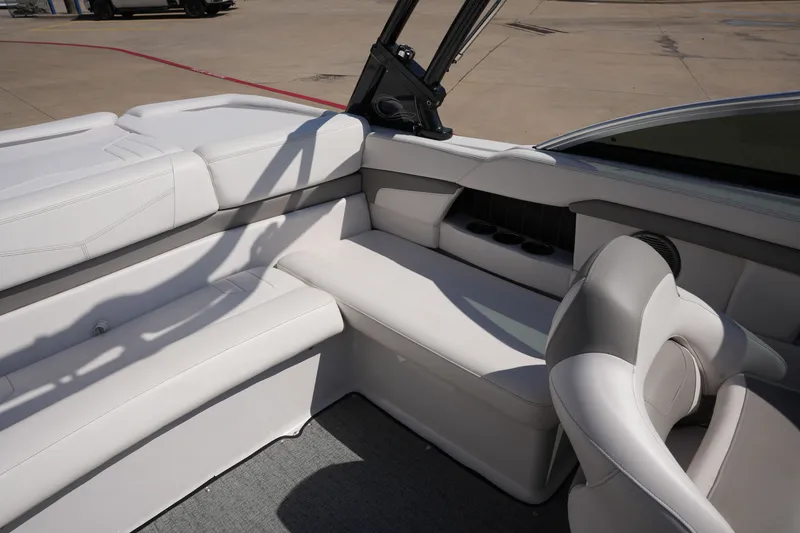 Slide: The Image of Interior of a 2019 Four Winns H230 boat with white seating. - 19