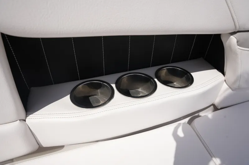 Slide: The Image of Three cup holders on a 2019 Four Winns H230 boat. - 20