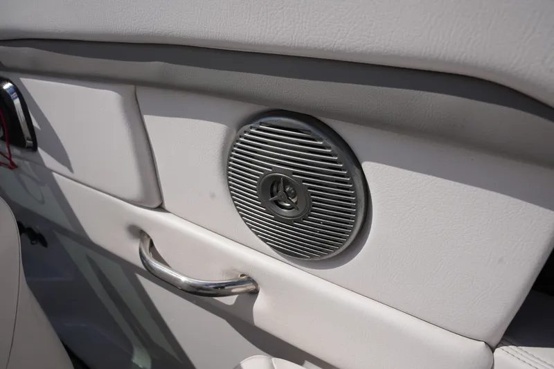 Slide: The Image of Speaker inside a 2019 Four Winns H230 boat interior. - 21
