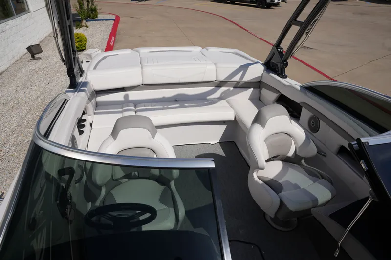 Slide: The Image of Interior of a 2019 Four Winns H230 boat with white seating. - 22