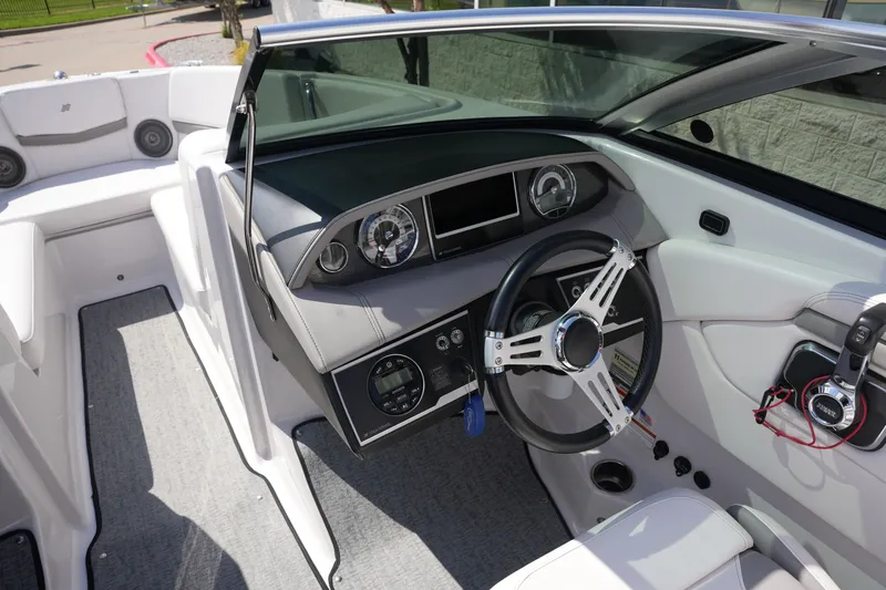 Slide: The Image of 2019 Four Winns H230 boat interior dashboard view. - 25