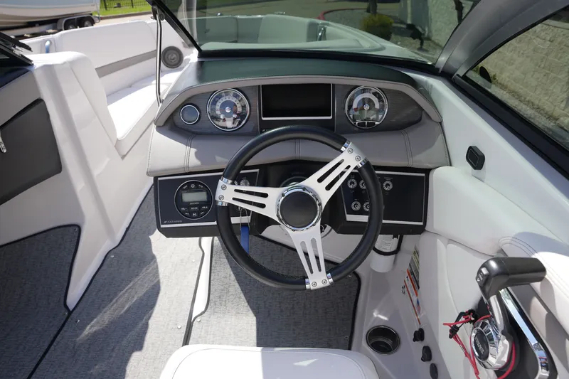 Slide: The Image of Interior view of 2019 Four Winns H230 boat cockpit. - 26