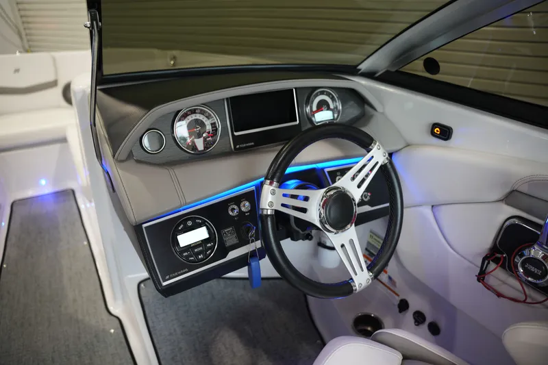 Slide: The Image of Interior view of 2019 Four Winns H230 boat cockpit. - 27