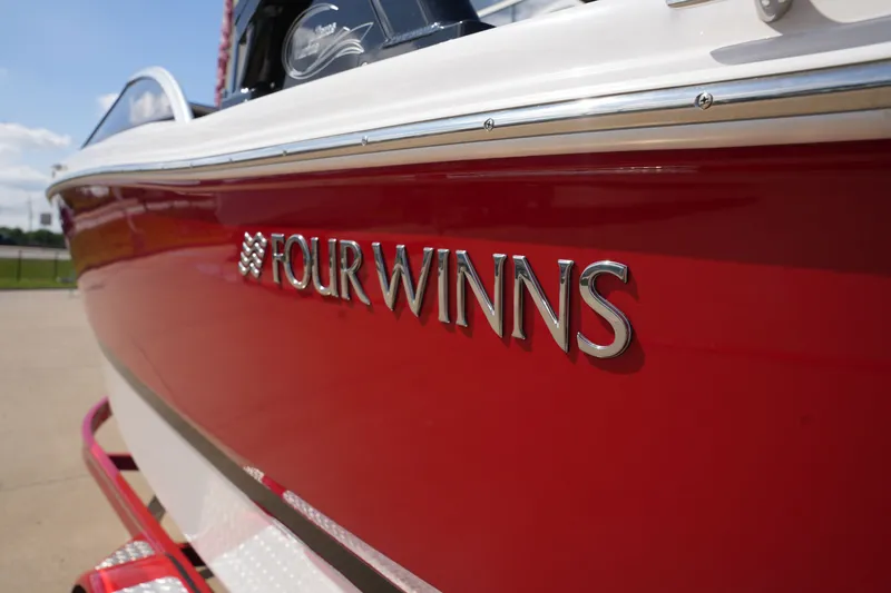 Slide: The Image of Red 2019 Four Winns H230 boat side view. - 3