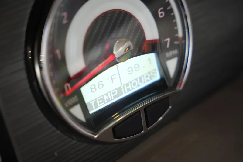 Slide: The Image of Four Winns H230 boat tachometer, temperature reading 86°F. - 30