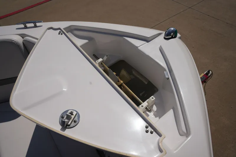Slide: The Image of 2019 Four Winns H230 boat with open storage compartment lid. - 39