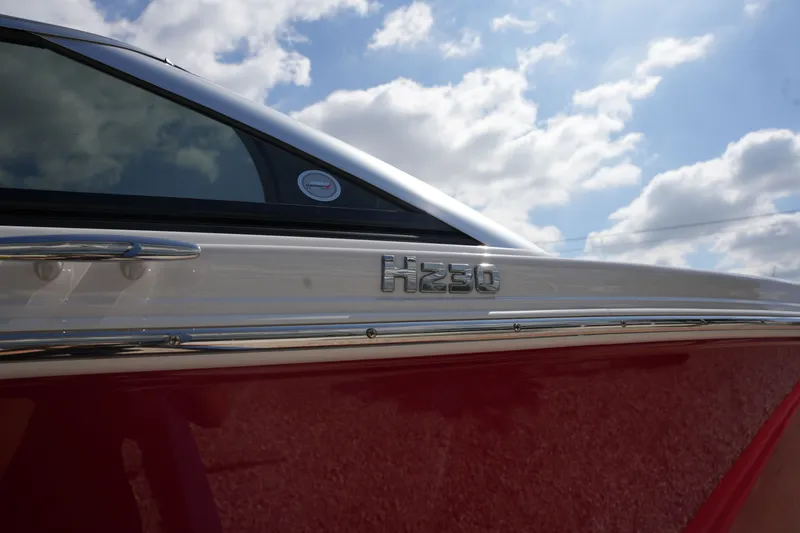Slide: The Image of 2019 Four Winns H230 boat with blue sky. - 4