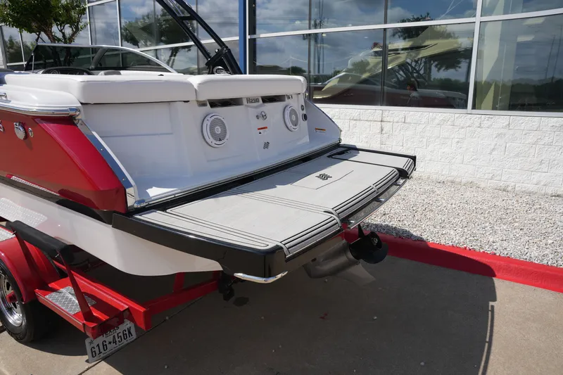 Slide: The Image of Rear view of a 2019 Four Winns H230 boat on trailer. - 6