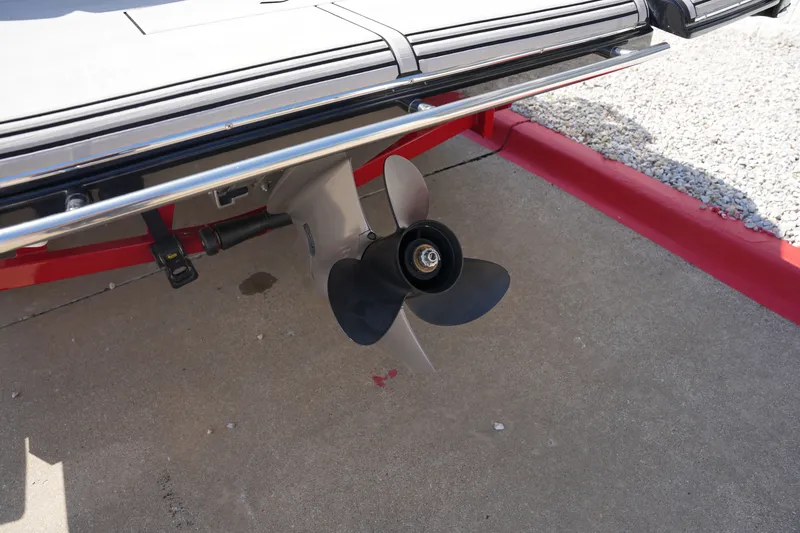 Slide: The Image of 2019 Four Winns H230 boat propeller on concrete surface. - 7