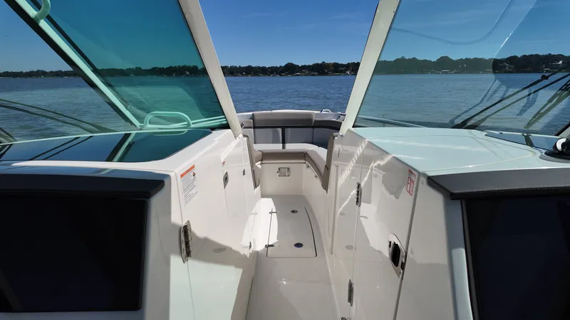Slide: The Image of The image shows the cockpit of a 2027 Boston Whaler 330 Vantage with a view of the water. - 25
