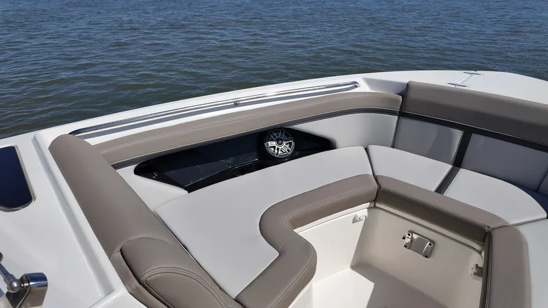 Slide: The Image of The 2027 Boston Whaler 330 Vantage features a sleek, cushioned seating area at the bow. - 28