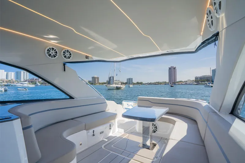 Slide: The Image of Luxurious 2025 NX Boats NX41 HORIZON interior with waterfront cityscape view. - 1