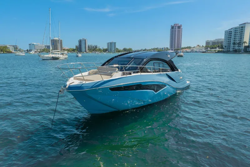 Slide: The Image of 2025 NX Boats NX41 HORIZON yacht on water with city skyline background. - 12