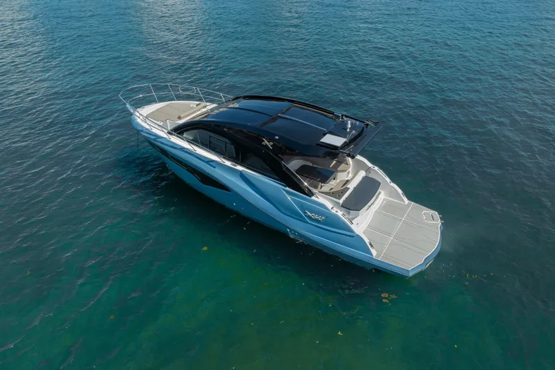 Slide: The Image of 2025 NX Boats NX41 HORIZON luxury yacht on clear blue water. - 16