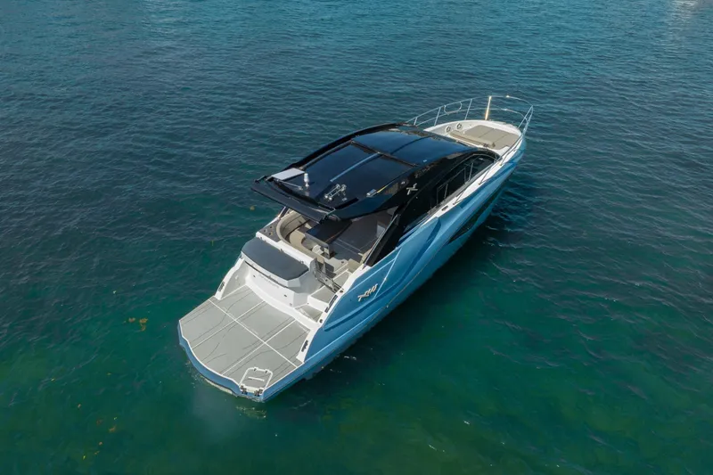 Slide: The Image of 2025 NX Boats NX41 HORIZON luxury yacht on clear blue water. - 17