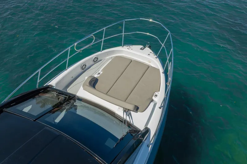 Slide: The Image of 2025 NX Boats NX41 HORIZON yacht with sunbed on turquoise water. - 18