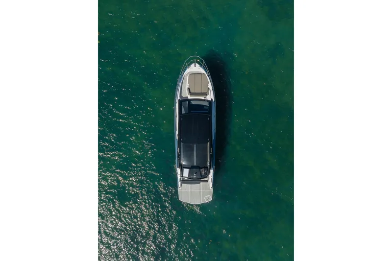 Slide: The Image of Aerial view of 2025 NX Boats NX41 HORIZON on clear green water. - 19