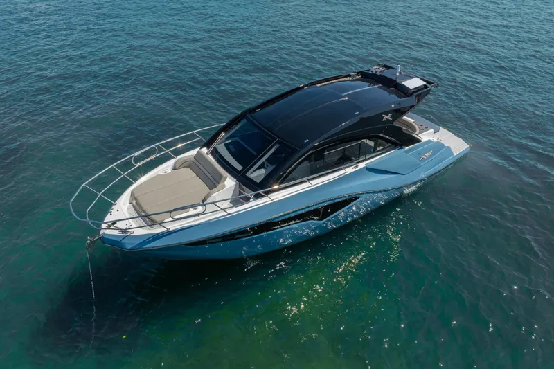 Slide: The Image of 2025 NX Boats NX41 HORIZON yacht on clear blue water, showcasing sleek design and luxury features. - 20