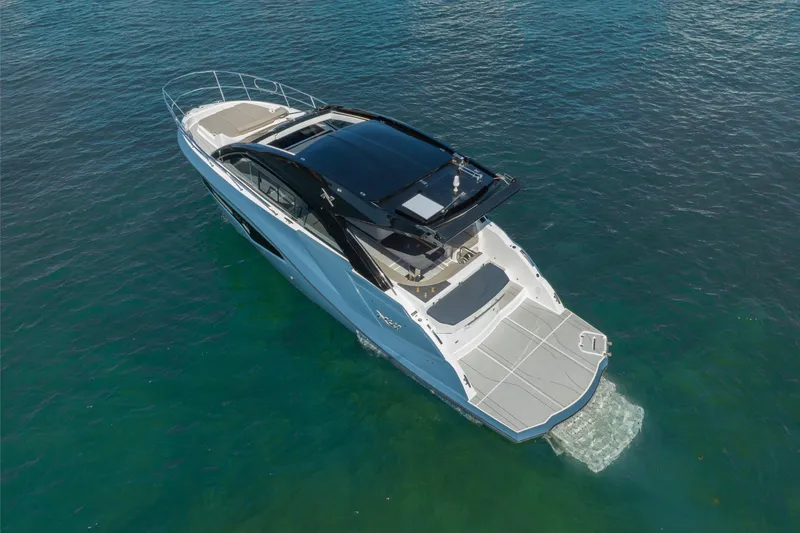 Slide: The Image of 2025 NX Boats NX41 HORIZON luxury yacht cruising on clear blue water. - 21