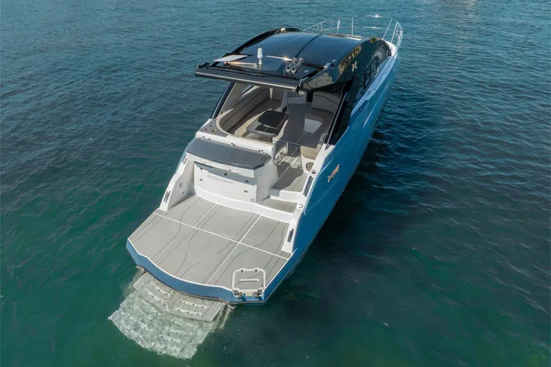Slide: The Image of 2025 NX Boats NX41 HORIZON luxury yacht on open water, rear view. - 23