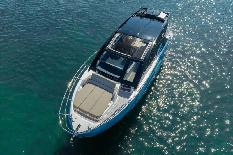 Slide: The Image of 2025 NX Boats NX41 HORIZON cruising on sparkling blue water. - 24