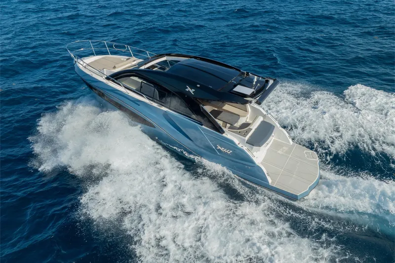 Slide: The Image of 2025 NX Boats NX41 HORIZON cruising on open sea, showcasing sleek design and performance. - 27