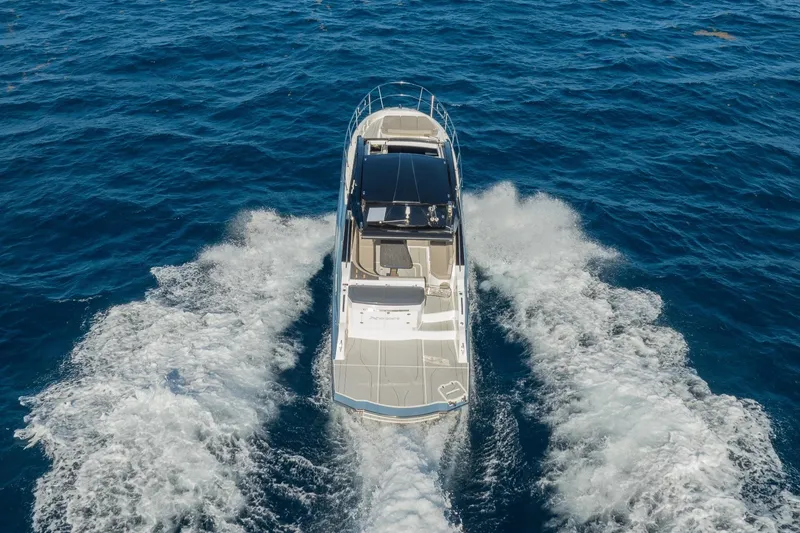 Slide: The Image of 2025 NX Boats NX41 HORIZON cruising on open sea, aerial view. - 28