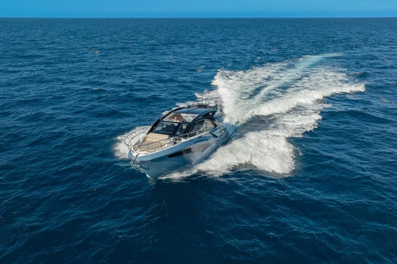 Slide: The Image of 2025 NX Boats NX41 HORIZON cruising on open blue ocean waters. - 29