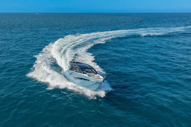 Slide: The Image of 2025 NX Boats NX41 HORIZON cruising on open ocean, creating dynamic water trails. - 31