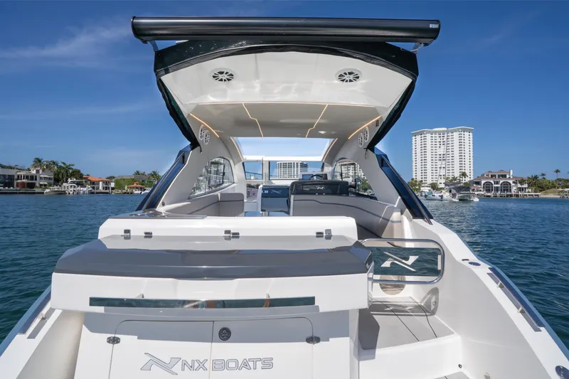 Slide: The Image of Luxury NX41 HORIZON boat by NX Boats, 2025 model, docked in scenic waterfront. - 37