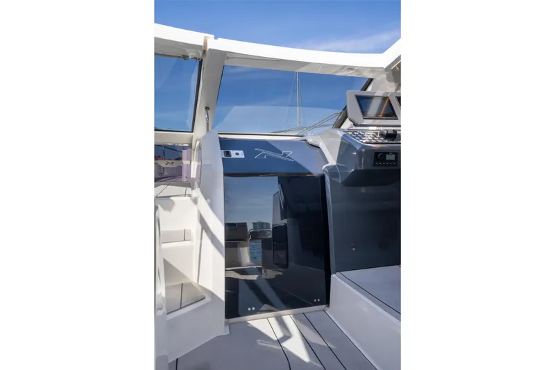 Slide: The Image of Interior view of 2025 NX Boats NX41 HORIZON cockpit with modern controls and sleek design. - 39