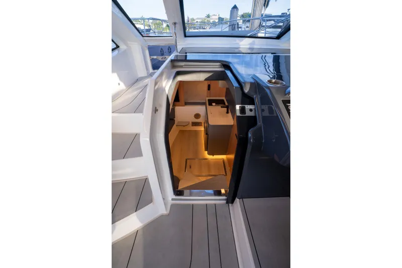 Slide: The Image of Interior view of 2025 NX Boats NX41 HORIZON, showcasing modern cabin design and lighting. - 42