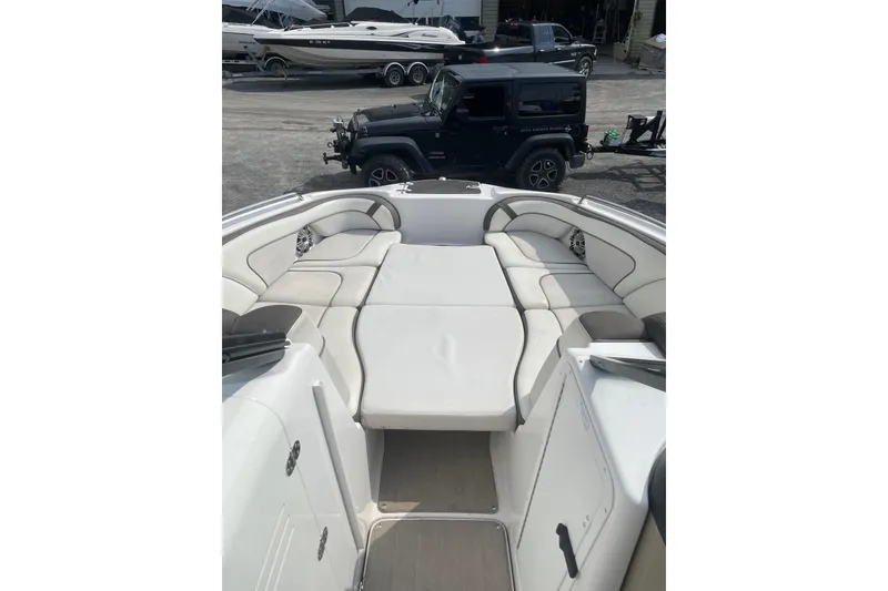 Slide: The Image of 2014 Yamaha Boats 242 Limited interior with spacious seating and sleek design. - 11